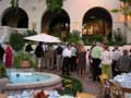 Chapter Presidents enjoy hors d'oeuvres and beverages in the courtyard.