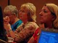 Travel agents listen intently to valuable information.